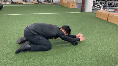 Childs Pose exercise on Foam Roller